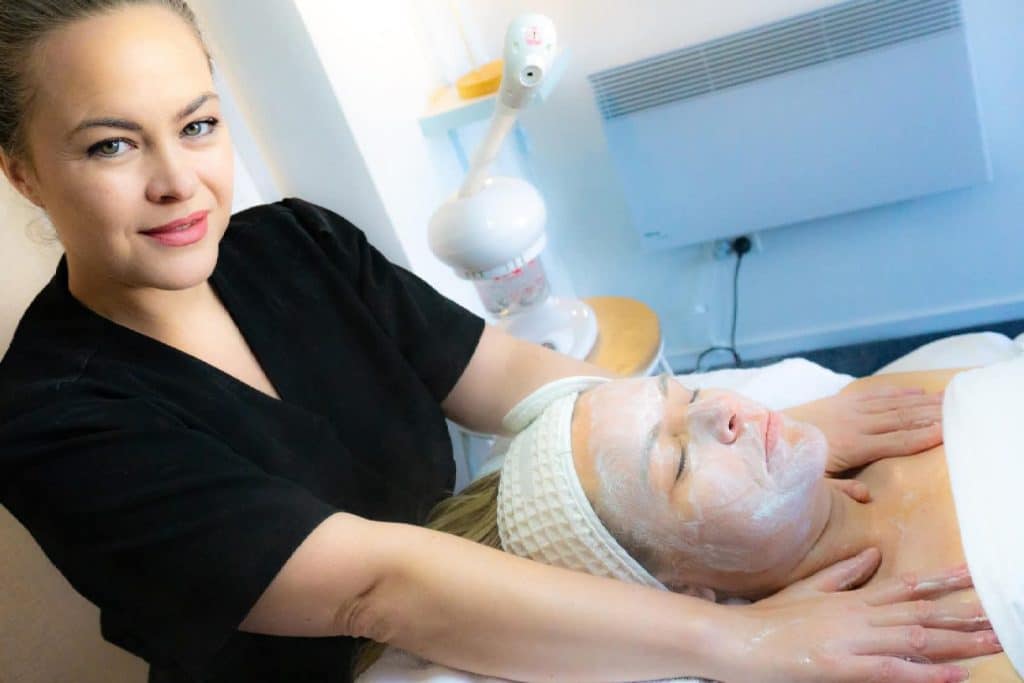 woman having facial therapy